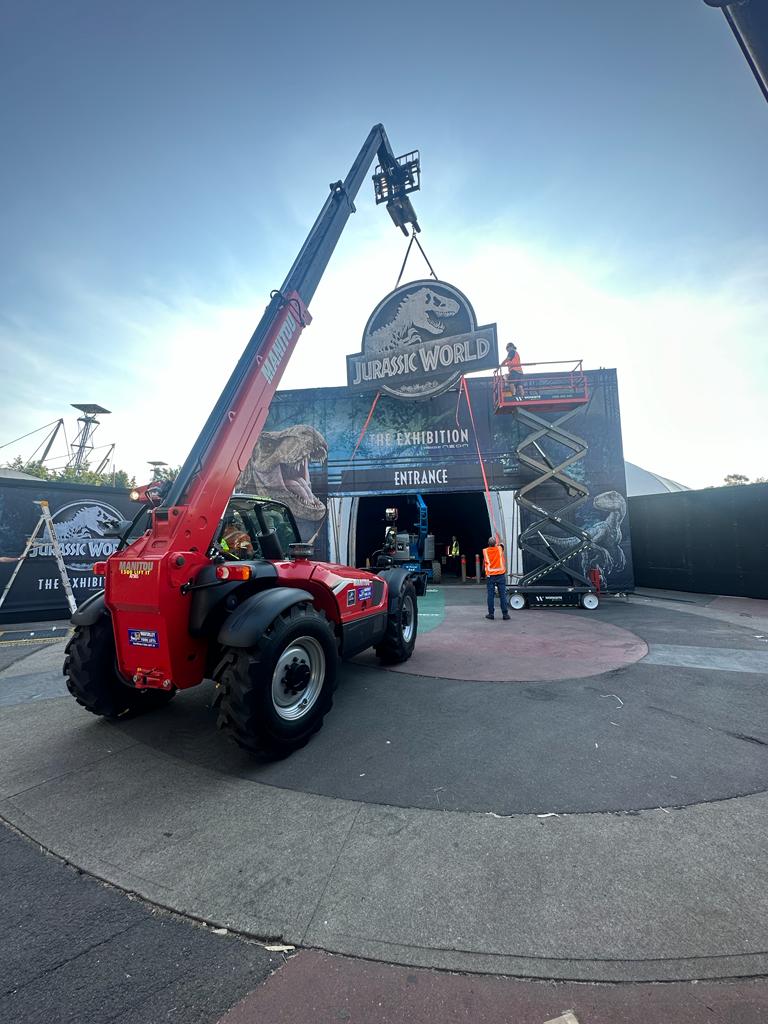 Tele-handler Forklift Installing Signage produced by 1800 Projects