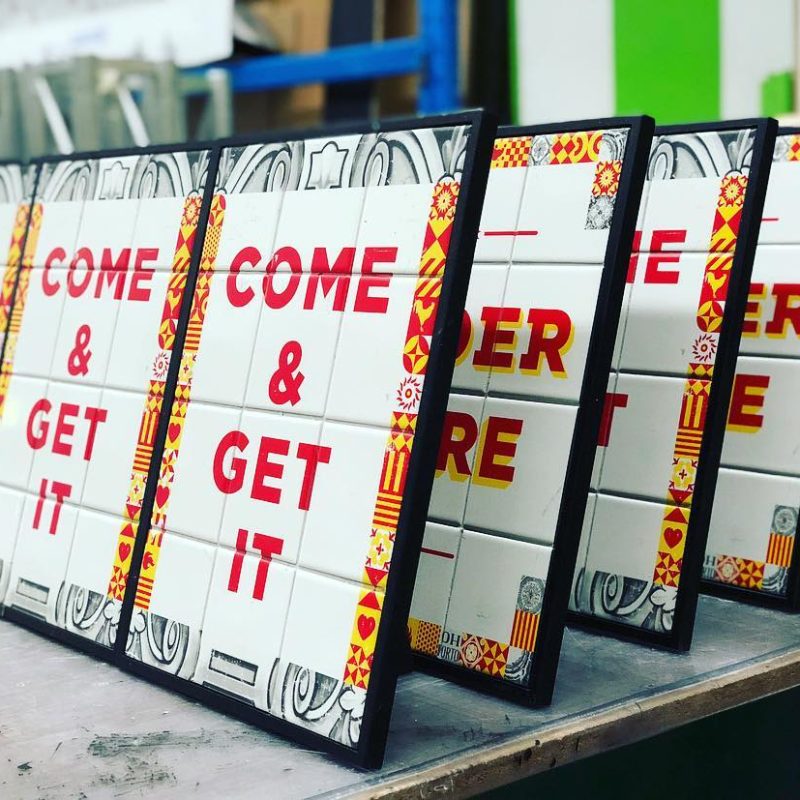 Made with Printed Tiles and Timber Backing the Come & Get It Counters Signs for Oporto by 1800 Projects