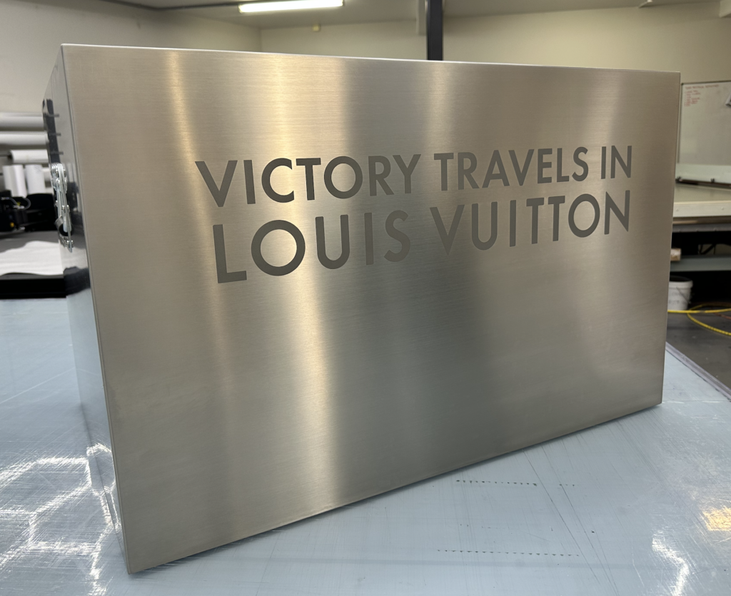 Custom made metal trophy plinth, complete with laser etched Louis Vuitton branding.